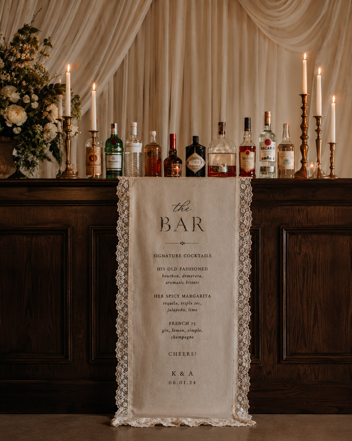 Reception bar setup with candles and a signature cocktail menu
